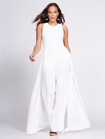 white jumpsuit with skirt overlay